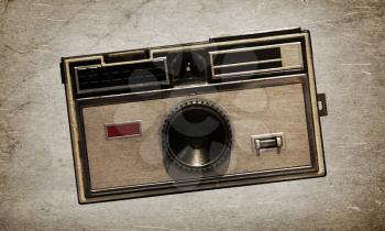 Old camera, isolated on a vintage background