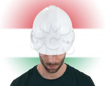 Isolated engineer with flag on background - Hungary