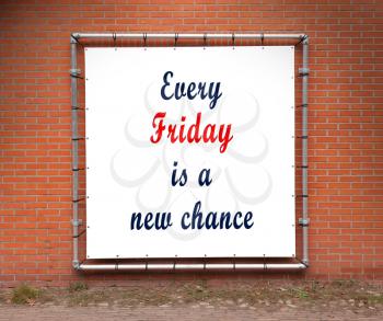 Large banner with inspirational quote on a brick wall - Every friday is a new chance