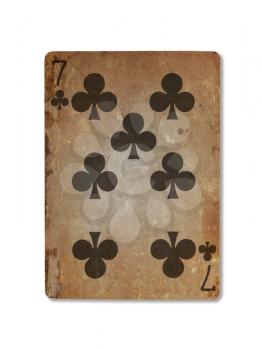 Very old playing card isolated on a white background, seven of clubs