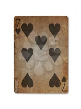 Very old playing card isolated on a white background, seven of hearts