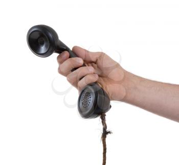 Male hand holding retro landline telephone, nearly broken cable