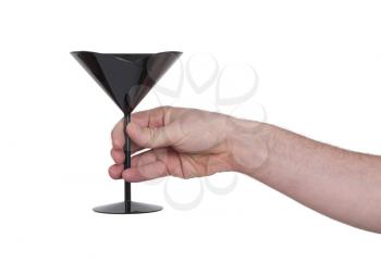 Black plastic coctail glass in hand, isolated on white