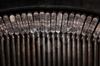 Types of vintage typewriter close-up, warm filter
