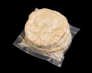 Israeli flat bread pita isolated on black background, packed in plastic