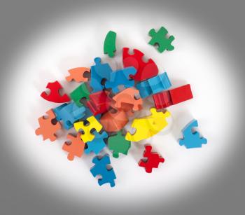 Closeup of big jigsaw puzzle pieces isolated on white