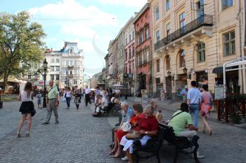 central street in Lvov with people having a rest