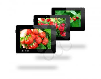 some black tablets with motley pictures with different plants