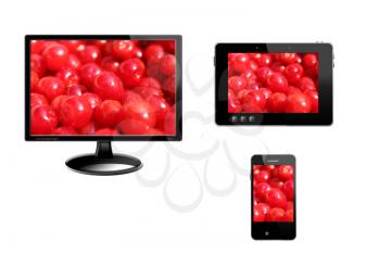 black tablet, modern mobile phone and monitor with image of berry of Prunus tomentosa
