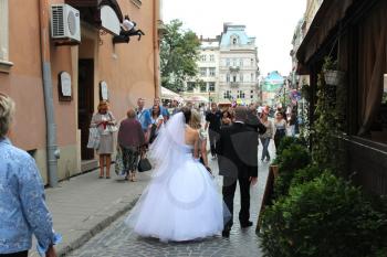 just married pair walking on the street in Lvov