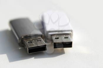 two USB flash drive lying on the white background