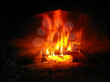 Fire wood brighly burning in the furnace