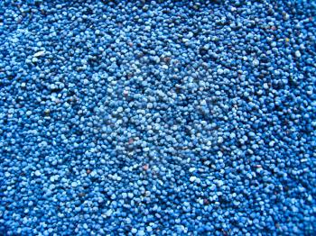 Dark blue background from grains of a poppy