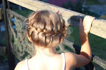little fashionable girl with beautiful modern coiffure