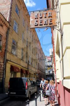 narrow street in Lvov with cozy caffe in the central part of Lvov