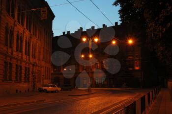 illuminated street of night Lviv city with many lanterns