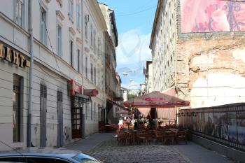 narrow street in Lvov with cozy cafe in the central part of Lvov