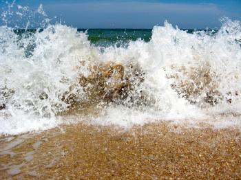 Marine waves on the sand of seacoast