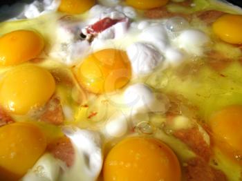 image of appetizing fried eggs during cooking