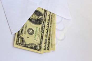 dollar banknotes in envelope as a bribe isolated on a white background