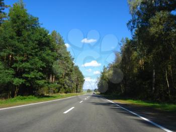 image of asphalted road and the blue sky