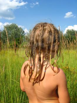 little girl with nice hair-do in the nature