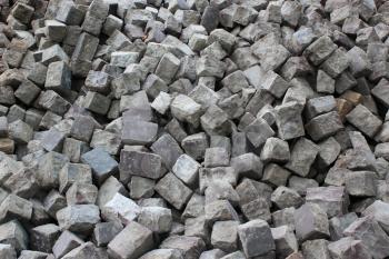 very many cobblestones prepared for making road