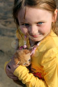 image of little girl with red kitten