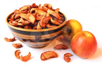 dried apples in the plate isolated on the white background