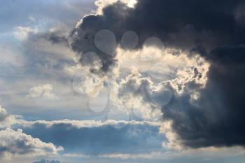cloud with unusual shape and sunny beams
