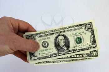 image of hand holding US dollars isolated on a white background