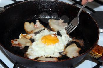 image of appetizing fried egg during cooking