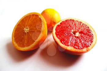 image of orange grapefruit and lemon divided in half