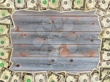 Frame from the American dollars on the wooden board background
