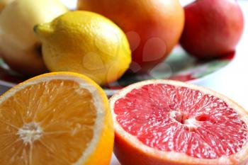 image of orange grapefruit and lemon divided in half