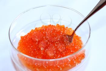 image of red caviar in a plate with the spoon