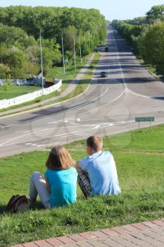 image of pair young enamoured people on a background of road