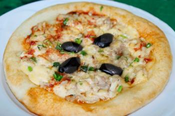 tasty pizza with an appetizing stuffing with olives