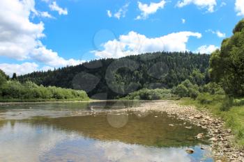 beautiful landscape with speed river in Carpathian mountains