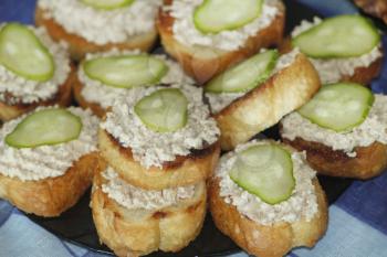 delicious toast with cod's liver and cucumbers