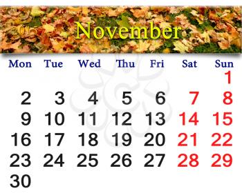 calendar for November of 2015 with the ribbon of moss and leaves