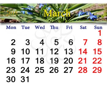 calendar for March of 2015 year with ribbon of first blue snowdrops