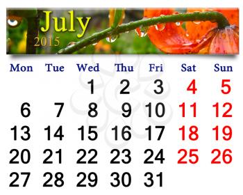 calendar for the July of 2015 with drops of water on red lilies after rain