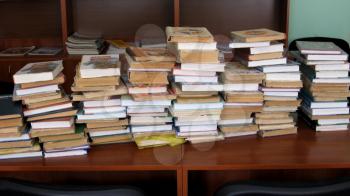big heaps of books in the library