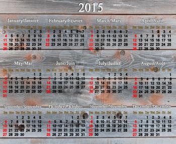 calendar for 2015 year in English and French on the wooden boards