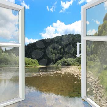 opened window overlooking the picturesque river and mountains
