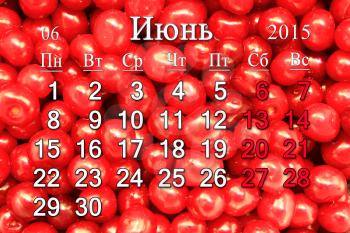 calendar for June of 2015 year with red berries of Prunus tomentosa in Russian