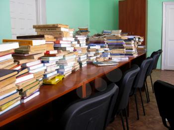 big heaps of books in the library