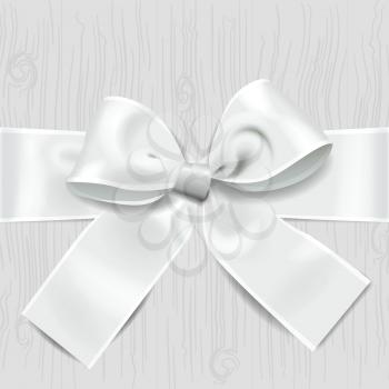 Christmas white background, silver ribbon bow on wooden tile