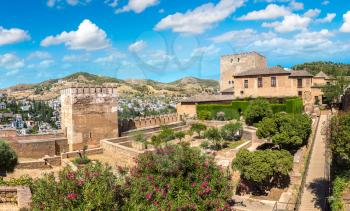 Nasrid palaces (Palacios Nazaries) and palace of Charles V in Alhambra palace in Granada in a beautiful summer day, Spain